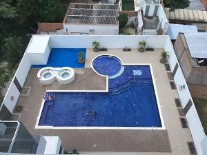 Bazén v ubytování Disfruta hermoso apartaestudio nebo v jeho okolí