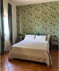 Krevet ili kreveti u jedinici u okviru objekta Villa confortevole con vista sul golfo