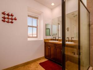 a bathroom with two sinks and a shower at Uber Chic and Comfortable San Felipe Home in San Felipe +20 photos