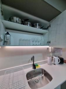 Kuchyň nebo kuchyňský kout v ubytování Apartamentos Bauerle Curitiba