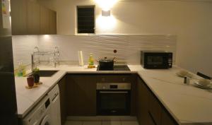 Kuchyň nebo kuchyňský kout v ubytování AD Apartment