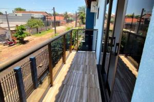 a balcony with a view of a street at Acomodação Três Fronteiras Foz in Foz do Iguaçu