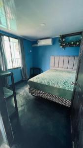 En eller flere senge i et værelse på Villa Kataleya