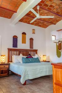 a bedroom with a bed with a ceiling at QUINTA BERNAL in Lo de Marcos