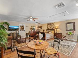 a living room with a couch and a table at College Park-Orlando 5Star Oasis - QUIET Neighborhood-PRIVATE-Free Parking-mins from EOLA,DT, Winter Park in Orlando