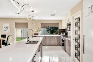 A kitchen or kitchenette at Spacious Holiday Home with Pool