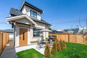a small house with a table and chairs in a yard at Three bedrooms brand new laneway house near public transit in Vancouver
