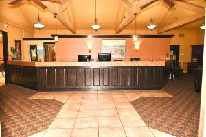 a lobby with a bar in a hotel at Fortune Inn & Suites in Newport