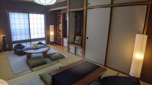 an overhead view of a living room with a table at Minamide Building 2-4F / Vacation STAY 6127 in Osaka