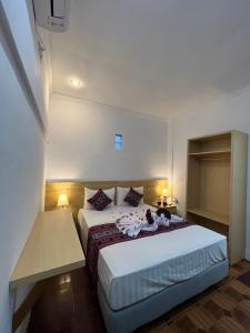 Voodi või voodid majutusasutuse Seaside Hotel toas