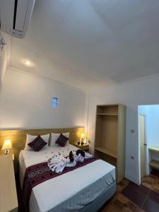 Voodi või voodid majutusasutuse Seaside Hotel toas