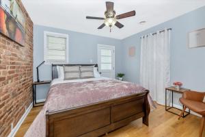 a bedroom with a bed and a ceiling fan at Cozy & Inviting Townhome in Frederick