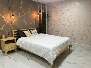 a bedroom with a bed and a wall with writing on it at Busch Gardens Bliss Suite-2 in Tampa