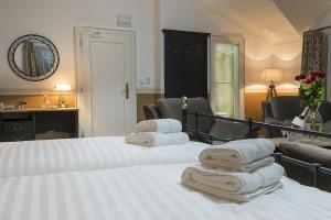 Postel nebo postele na pokoji v ubytování Hotel Pod Bránou