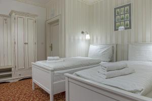 Postel nebo postele na pokoji v ubytování Hotel Pod Bránou