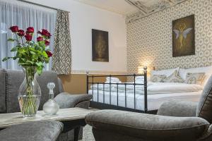 Postel nebo postele na pokoji v ubytování Hotel Pod Bránou