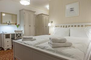 Postel nebo postele na pokoji v ubytování Hotel Pod Bránou