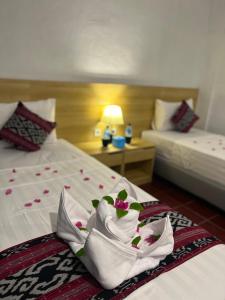 Voodi või voodid majutusasutuse Seaside Hotel toas