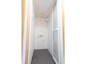 a small bathroom with a shower and a toilet at Guest House Goto Times - Vacation STAY 59196v in Goto