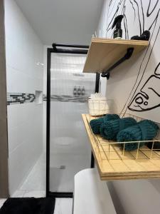 a bathroom with a shower and some towels on a shelf at Busch Gardens Bliss Suite-2 in Tampa +43 photos