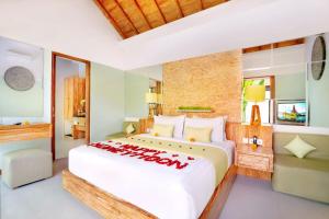 Postel nebo postele na pokoji v ubytování Manca Villa Canggu by Ini Vie Hospitality