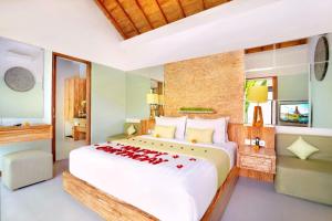 Postel nebo postele na pokoji v ubytování Manca Villa Canggu by Ini Vie Hospitality