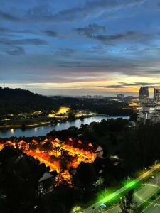 a view of a city with a river at night at The Halt Putrajaya in Putrajaya