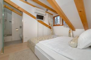 Una cama o camas en una habitación de Villa Valeria