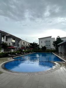 a large blue swimming pool in front of some buildings at C113 Home-1bedroom in Phnom Penh