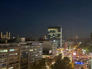 a view of a city at night with lights at Hotel Etap Mola in Ankara