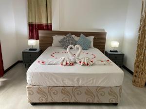 מיטה או מיטות בחדר ב-Mer Riviere Self Catering Apartment