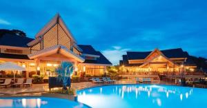 a large house with a swimming pool at night at Apo 201-Alta Vista De Boracay in Boracay