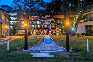 a building with a bunch of barrels in front of it at Bagan Pinang Guest House in Port Dickson