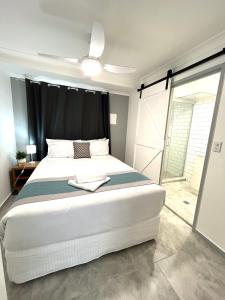 a bedroom with a large bed with a black curtain at Broadwater Keys Holiday Apartments in Gold Coast +110 photos