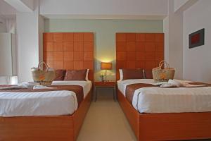 Postel nebo postele na pokoji v ubytování Aloha Boracay Hotel