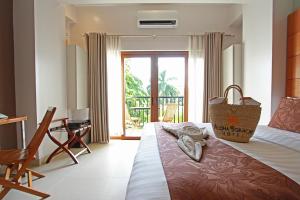 Postel nebo postele na pokoji v ubytování Aloha Boracay Hotel