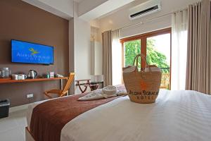 Postel nebo postele na pokoji v ubytování Aloha Boracay Hotel