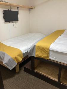 Postel nebo postele na pokoji v ubytování GreenHotel
