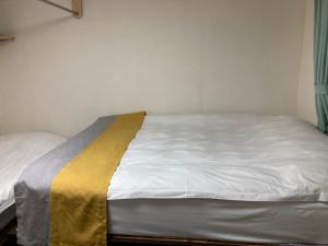 Postel nebo postele na pokoji v ubytování GreenHotel