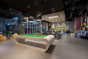 a billiard room with a pool table in it at Sanya Haitang Bay Moutai Resort Boutique Hotel in Sanya