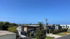 an aerial view of houses in a city at Heart of Torquay - Whitewater Apartment - Torquay in Torquay