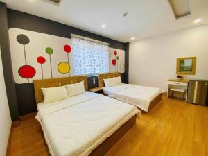 Ένα ή περισσότερα κρεβάτια σε δωμάτιο στο Jolilian Hotel & Apartment