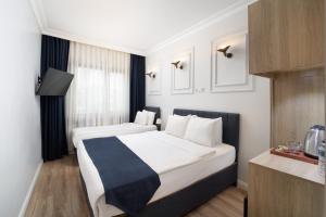Postel nebo postele na pokoji v ubytování Elan Hotel Istanbul Pera