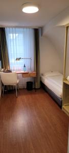 Postel nebo postele na pokoji v ubytování Hotel Minerva