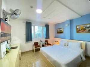 Kama o mga kama sa kuwarto sa A25 Hotel - 22 Nguyễn Cư Trinh