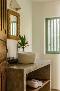 a bathroom with a sink on a counter with a mirror at The Last House in Tangalle +70 photos