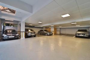 a garage with several cars parked in it at Hotel Yam Yeonsan in Busan