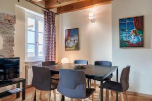 a dining room with a table and chairs at Residence V in Ponte di Legno