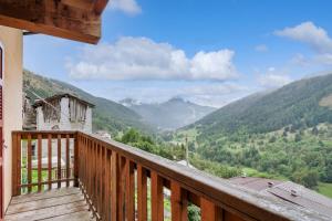 a balcony of a house with a view of mountains at Residence V in Ponte di Legno