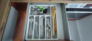 a drawer filled with utensils in a kitchen at Blu Home/Ferienwohnung in Ostrach